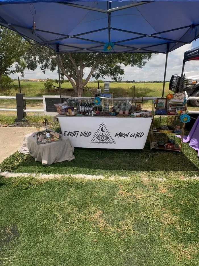 The Earth Wild Moon Child booth at an outdoor vendor market